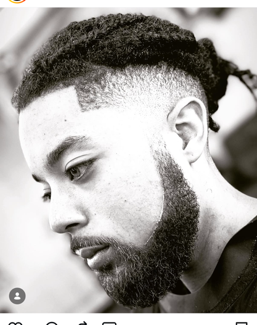 Braided hairstyle with a sculpted beard and sharp lineup by The Don LA