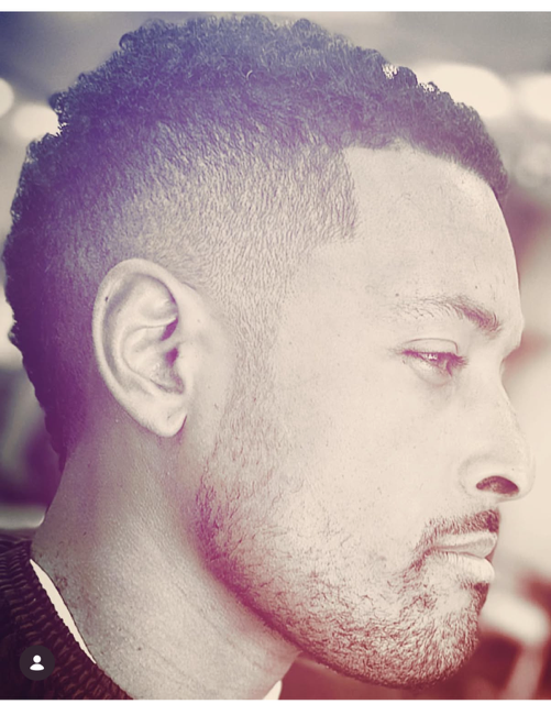 Textured haircut with a smooth fade by The Don LA